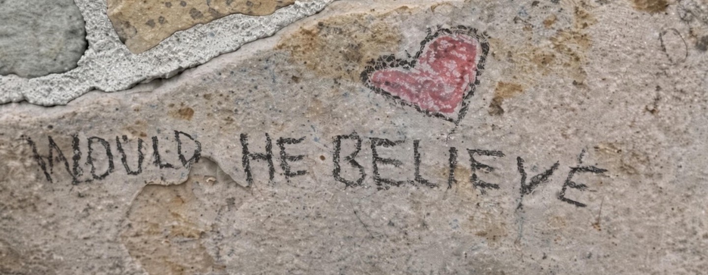 Would He Believe written on the Graceland wall, with a red heart tilted over the i